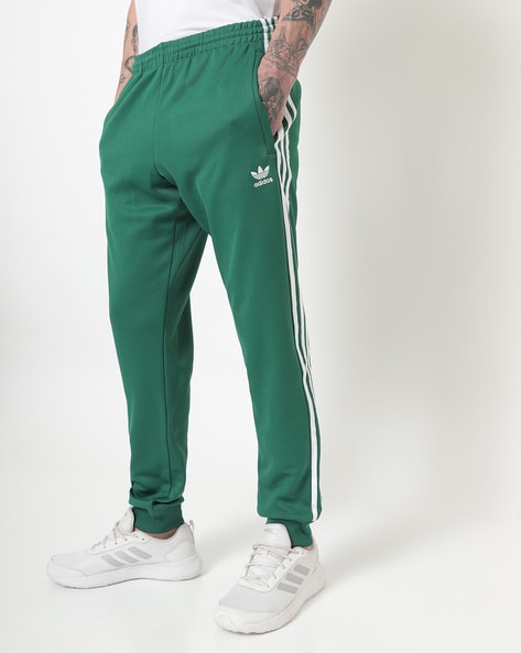 adidas Originals Superstar trackpants in green | ASOS