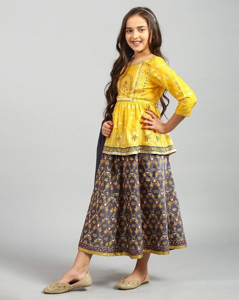 Bright yellow intricately printed crushed-style cotton skirt with  embroidered border & tassels