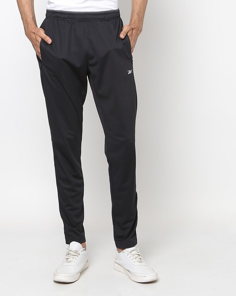 Training Essentials Woven Cuffed Pants in VECTOR NAVY | Reebok Official  Denmark