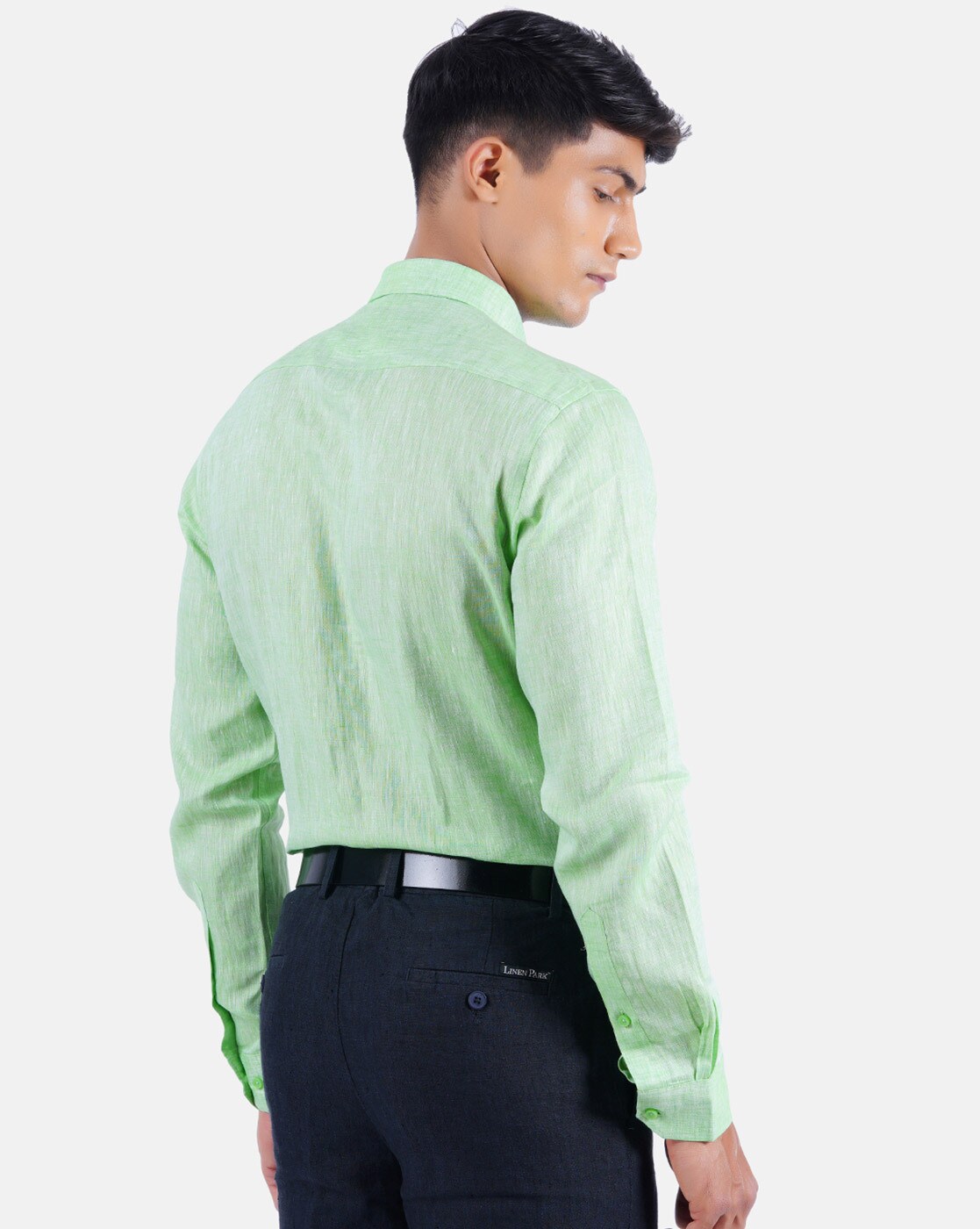 light green shirt and black pants