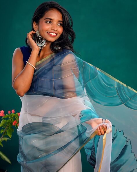 What colour blouse goes best with sky/light blue silk cotton saree? - Quora