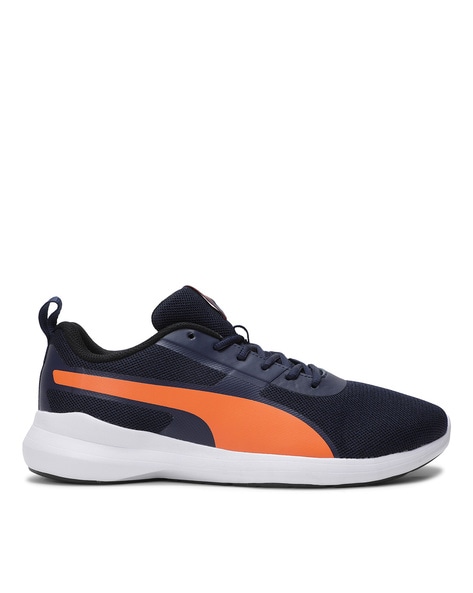 navy blue and orange pumas