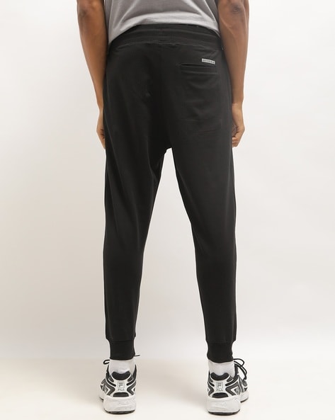 Adidas originals joggers with cut and sew best sale in black