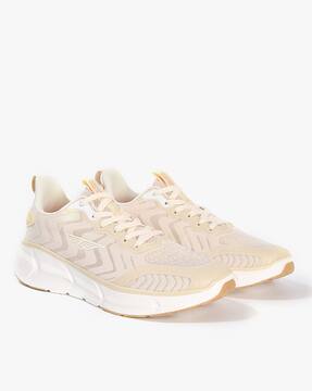 beige training shoes