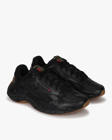 All black reebok clearance sneakers