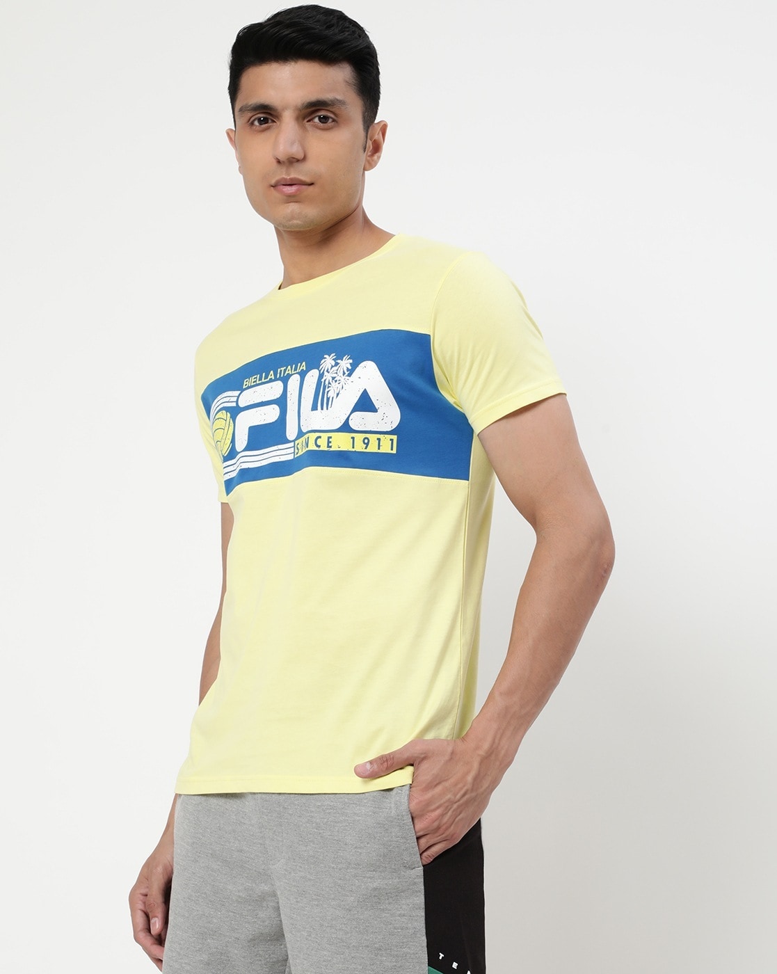 Yellow fila shirt on sale men