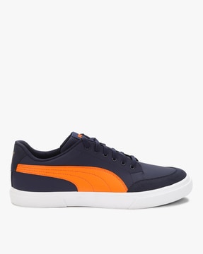 blue and orange puma shoes