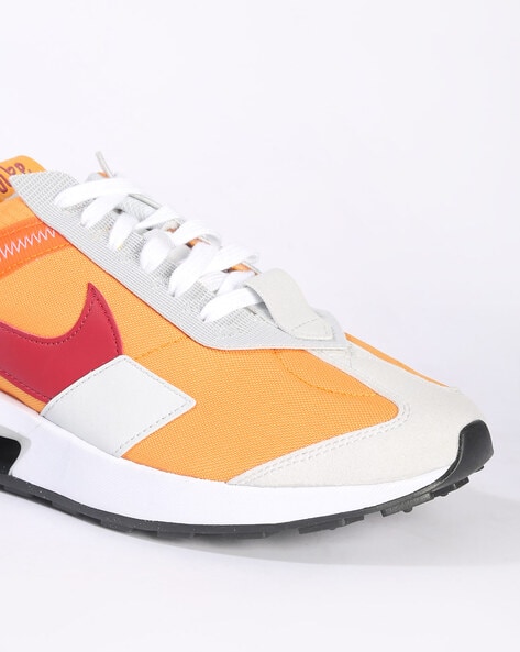 Orange and white store nike trainers