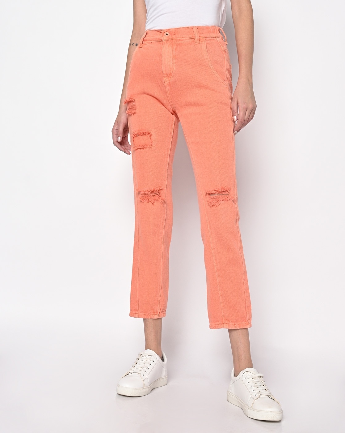 orange distressed jeans