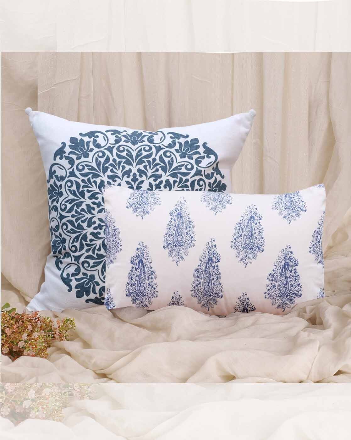 cream and white cushion covers