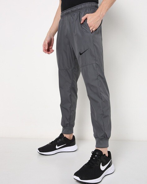 nike track pants with zip pockets