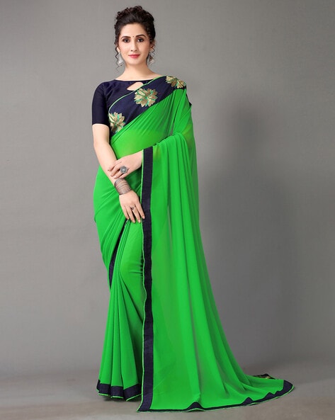 Dark forest green bridal saree with crystal stones on its body, intricate  scallop stone work border