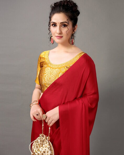 New designer red color party wear silk saree with contrast blouse.