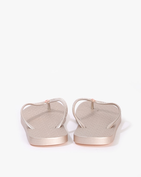 Tommy hilfiger rose gold flip online flops