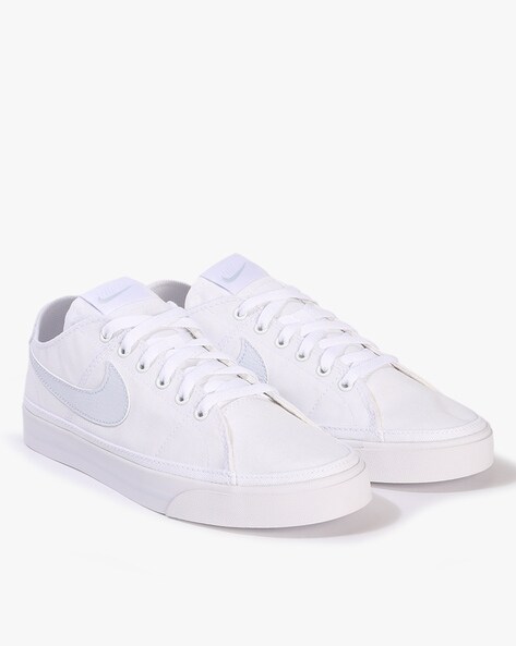 Nike white store canvas sneakers womens