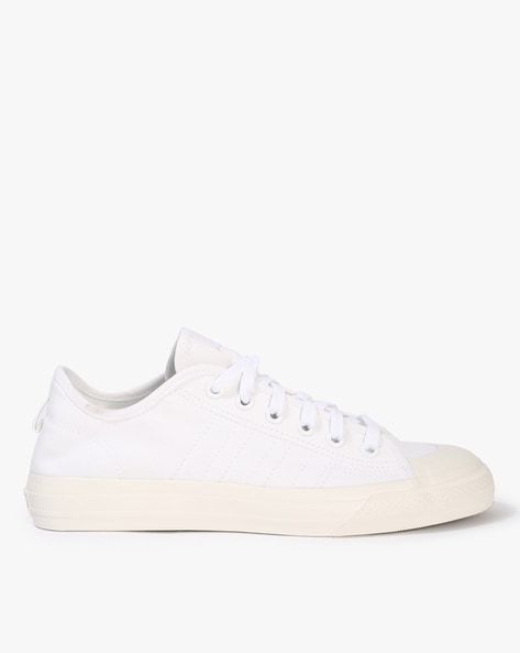 White canvas adidas on sale shoes