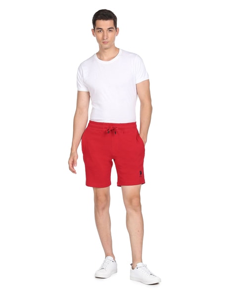 Red Bermuda Shorts with White Polo Shirt