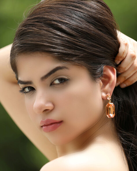 Beautiful Woman with Freckles and Earrings