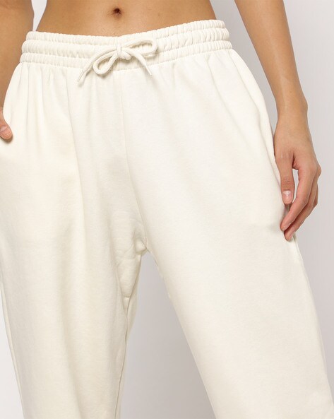 Buy NA-KD women high rise solid drawstring jogger pants off white Online