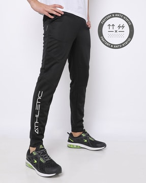 black joggers with white writing