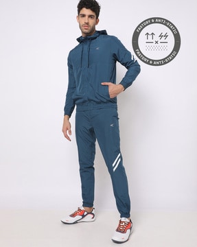 https://assets.ajio.com/medias/sys_master/root/20220909/oSIx/631a4becf997dd1f8def0a43/performax_teal_hooded_tracksuits_with_insert_pockets.jpg