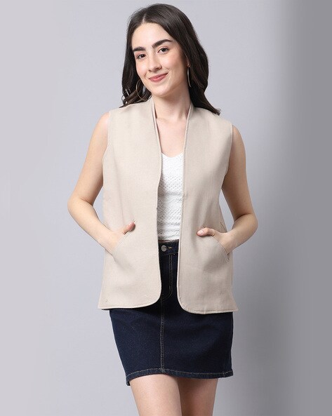 cream sleeveless jacket