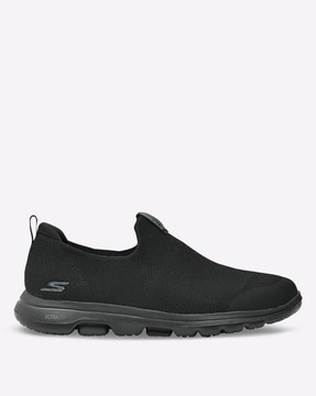 Plain sale black skechers