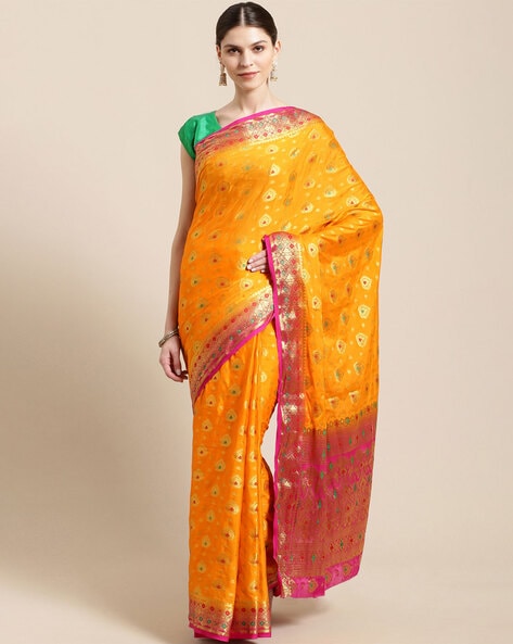 Orange colour Organza Banarasi saree with golden zari motif all over and  contrast pink zari border COST : 8900 INR ** Click on the link to pay and  buy... | By Vasthram