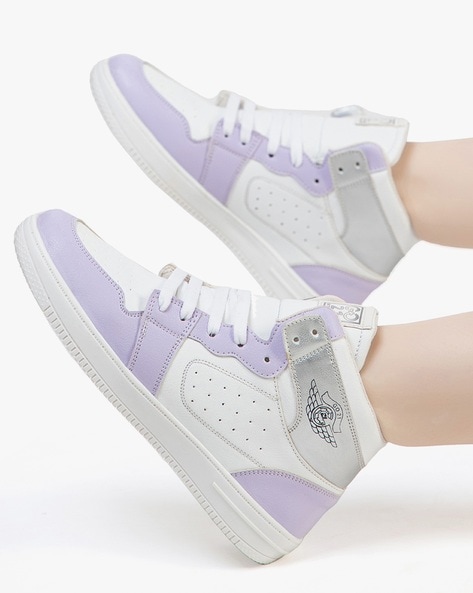 Purple and store white sneakers