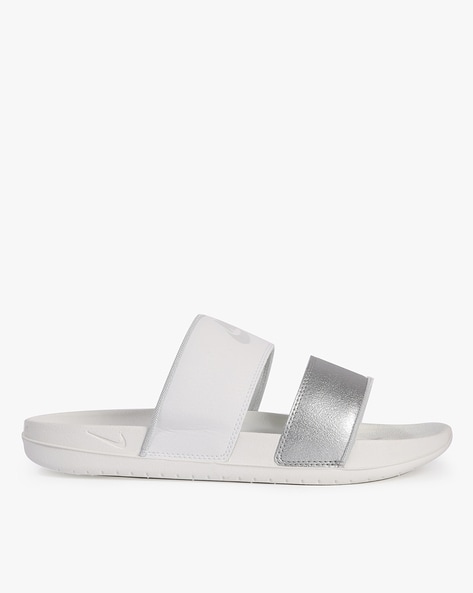 White and silver online nike slides