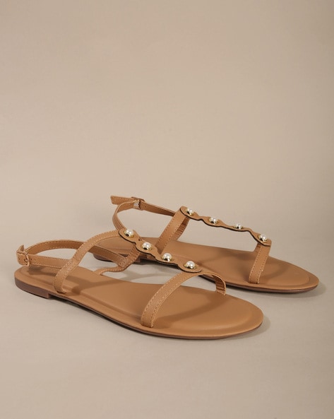 Buy Gold Embellished Pearl Metallic Sandals by Myra Online at Aza Fashions.