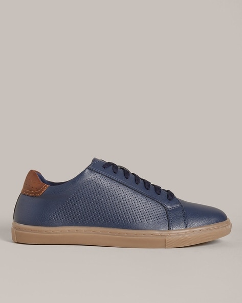 80% OFF on The Roadster Lifestyle Co Men Navy Blue Textured Lightweight  Faux Leather Sneakers on Myntra | PaisaWapas.com