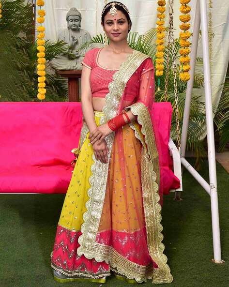 Photo of Bright pink light bridal lehenga with yellow dupatta