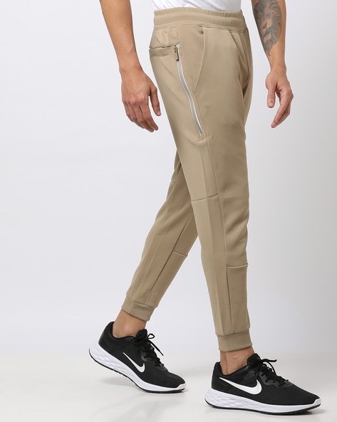 Nike beige online joggers