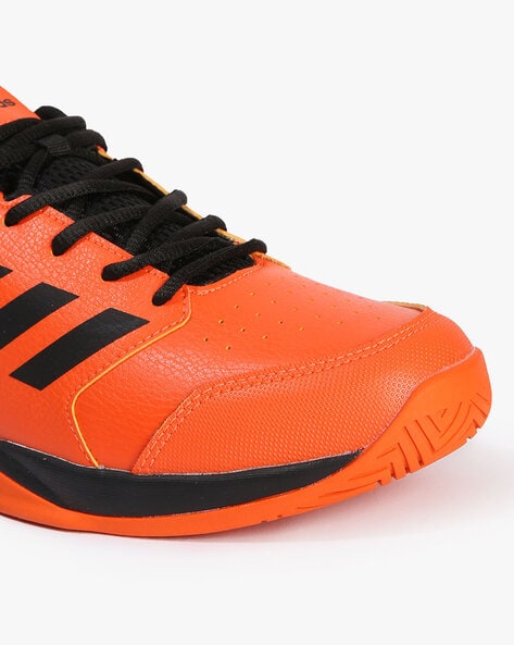 Orange adidas sales tennis shoes