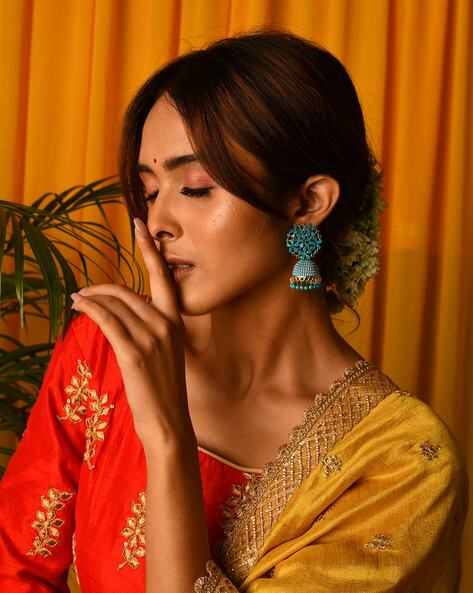 Anusree Nair looks beautiful in a yellow kkaddi georgette saree!