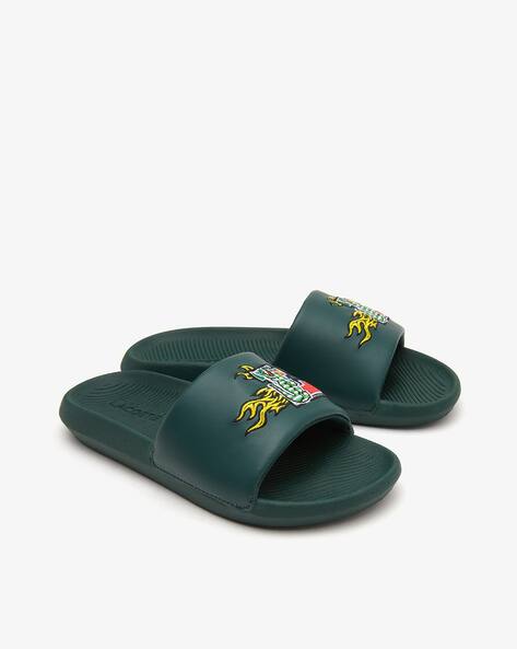 lacoste green flip flops