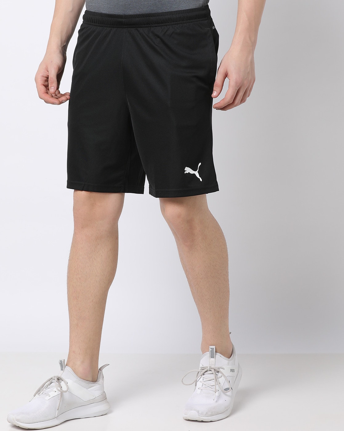 black puma football shorts