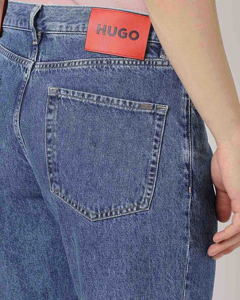 HUGO - Relaxed-fit jeans in blue rigid denim