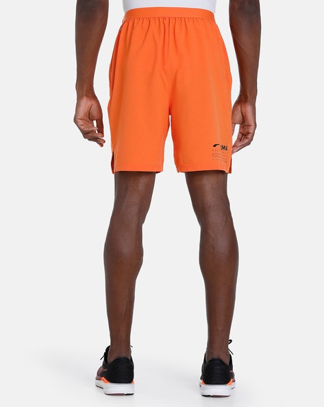 Mens orange shop puma shorts