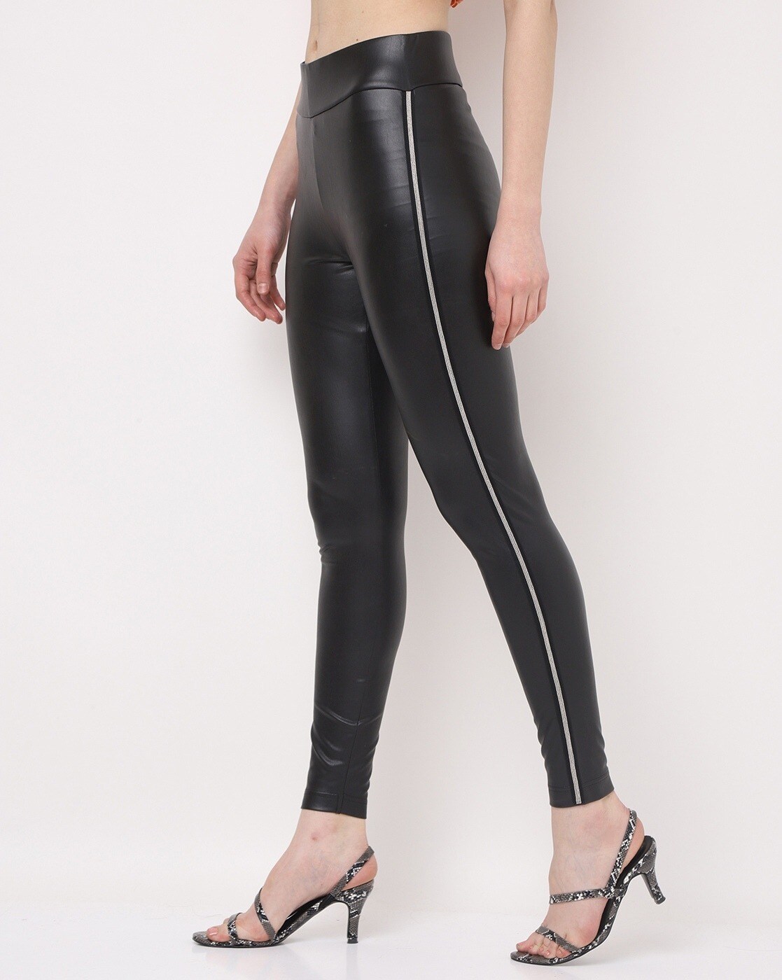 Black vegan leather pants with gold side stripe looks stylish when paired  with a leopard print blouse and transp… | Side stripe trousers, Shiny pants,  Leather pants