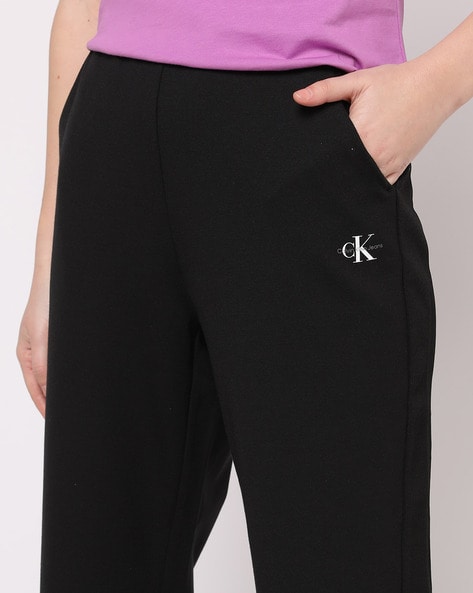 Buy Calvin Klein Jeans Women Solid Elasticated Mid Rise Joggers - Track  Pants for Women 21199462 | Myntra
