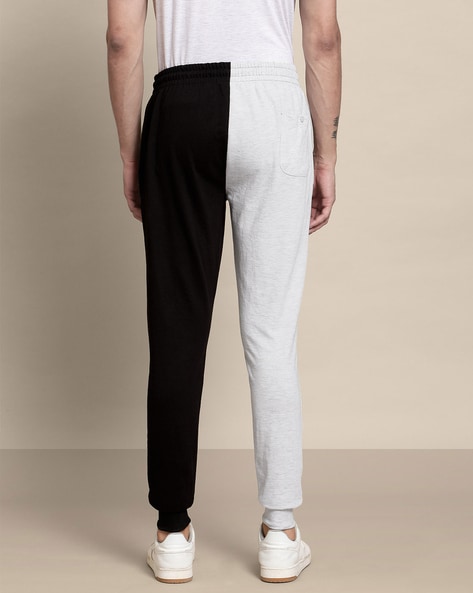 Half black half white best sale track pants