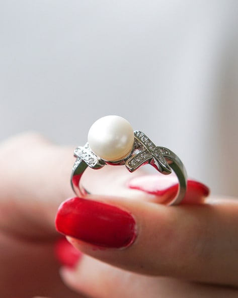 Premium Photo | Jewelry gold rings with white pearl and diamond women  accessories