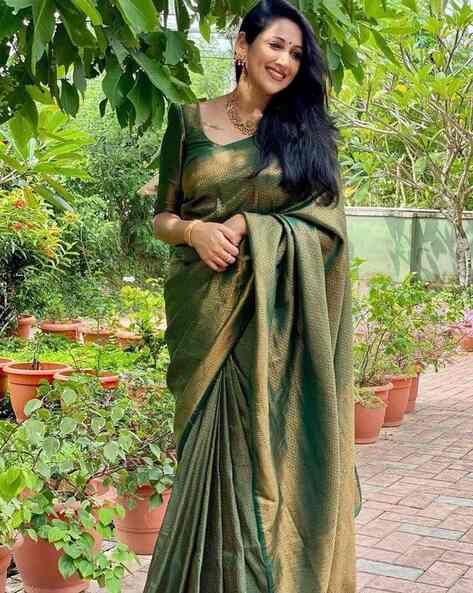 Beautiful Indian young girl in Traditional Saree posing outdoors 4976104  Stock Photo at Vecteezy