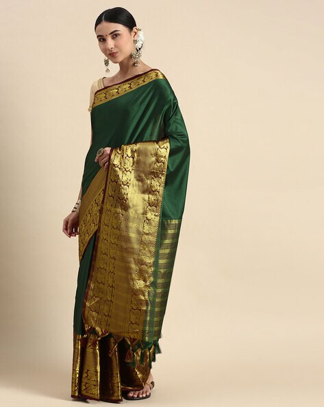 Gratifying Green Cotton Silk Saree With Flaunt Blouse Piece