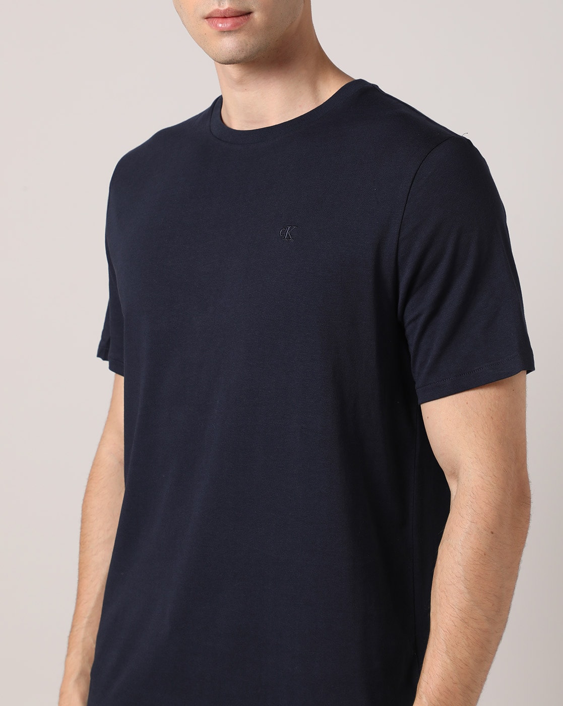 Calvin Klein Jeans Solid Men Round Neck Dark Blue T-Shirt - Buy Calvin  Klein Jeans Solid Men Round Neck Dark Blue T-Shirt Online at Best Prices in  India