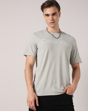 Calvin Klein Jeans Solid Men Polo Neck White T-Shirt - Buy Calvin Klein  Jeans Solid Men Polo Neck White T-Shirt Online at Best Prices in India