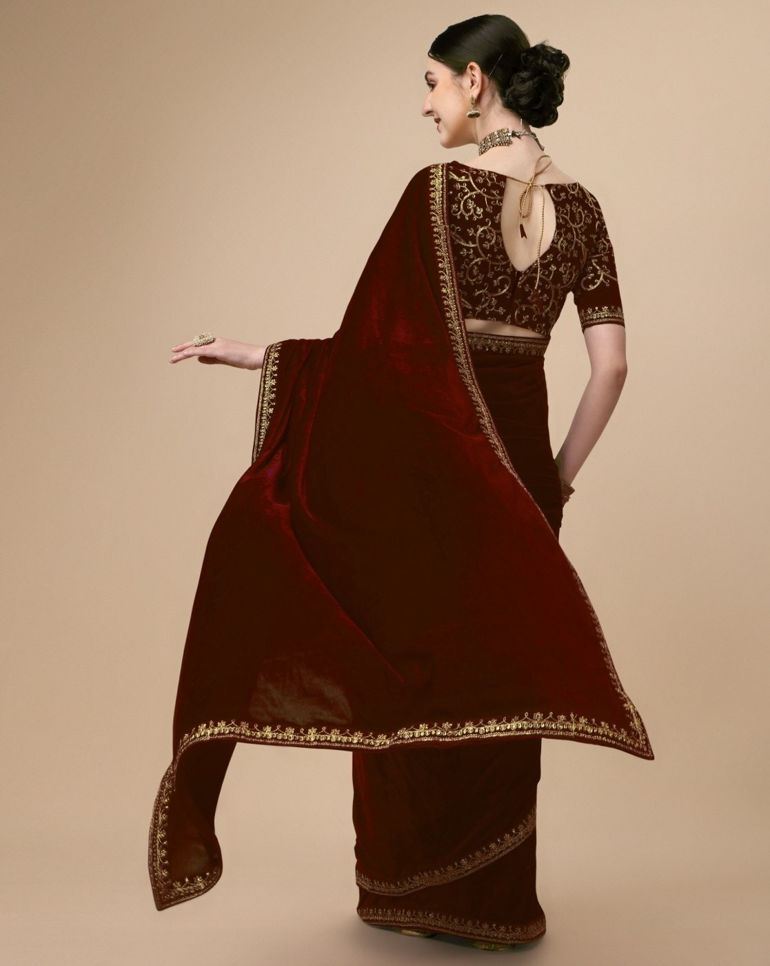 Photo of Black saree with a maroon velvet blouse.