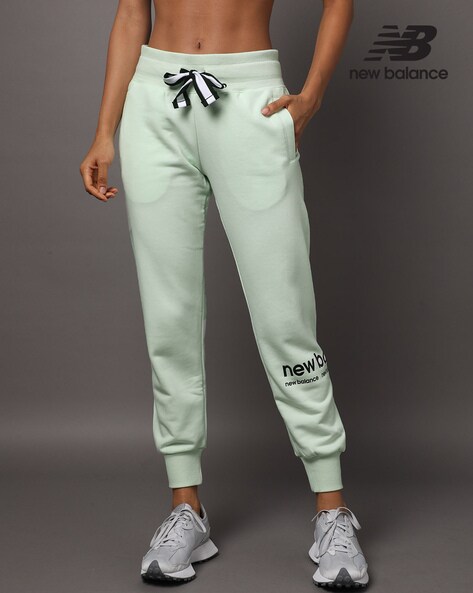 Buy Off White Track Pants for Women by NEW BALANCE Online